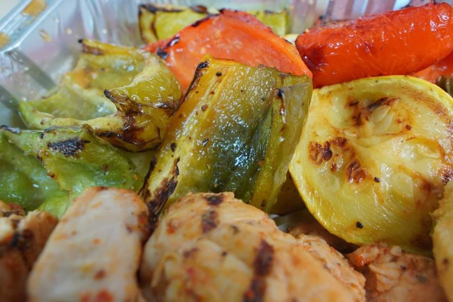 Grilled bell peppers, zucchini, and summer squash with chicken kabob — ANI Catering