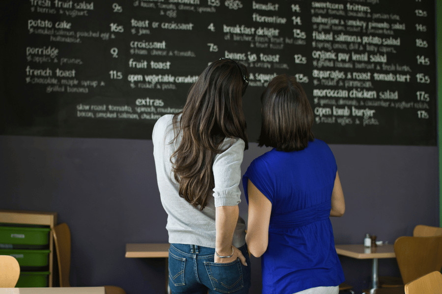 office manager looking at the menu to decide what items to order for catering
