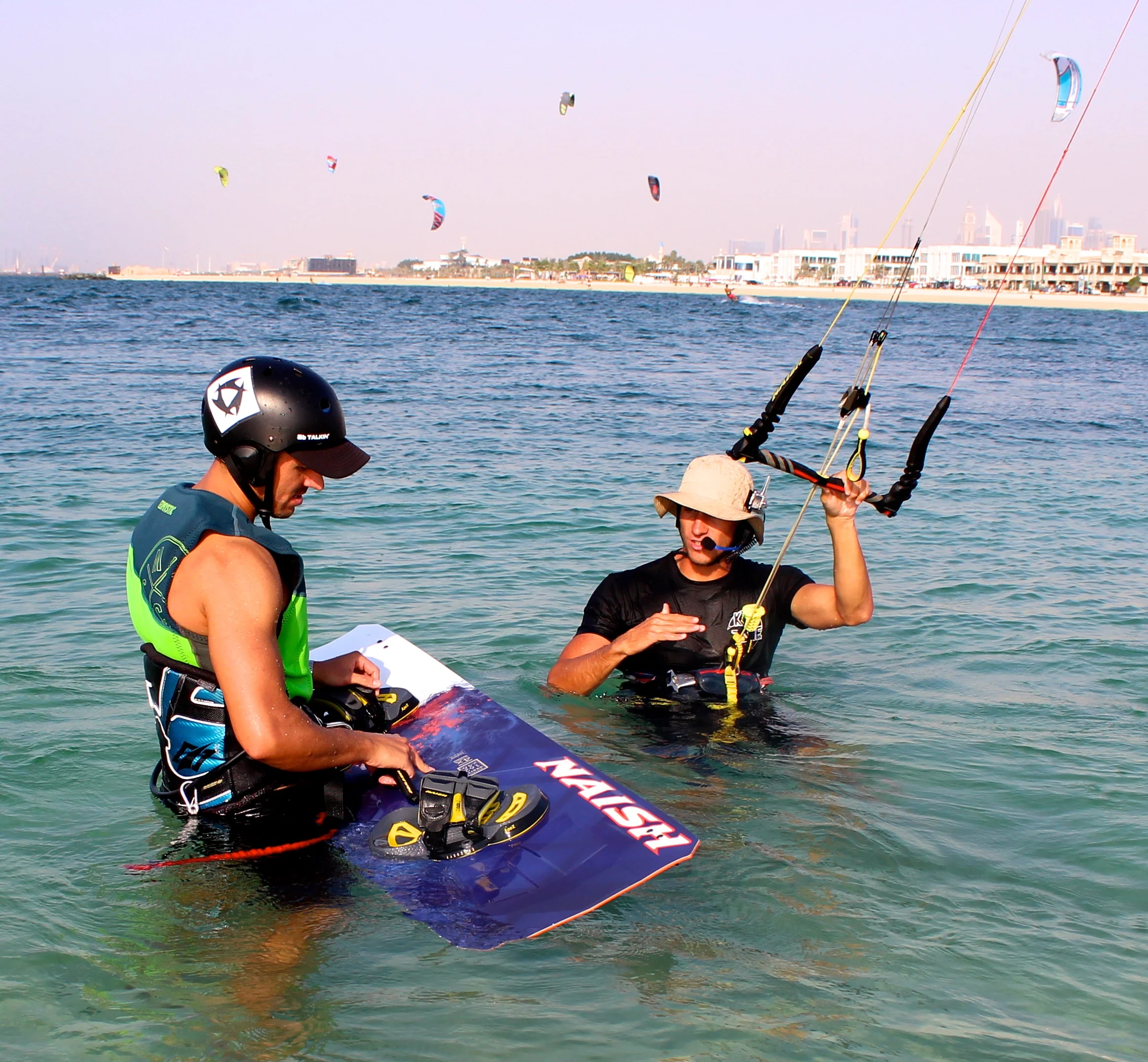 OUR KITESURFING INSTRUCTORS NOW TEACH WITH RADIO HELMETS :)