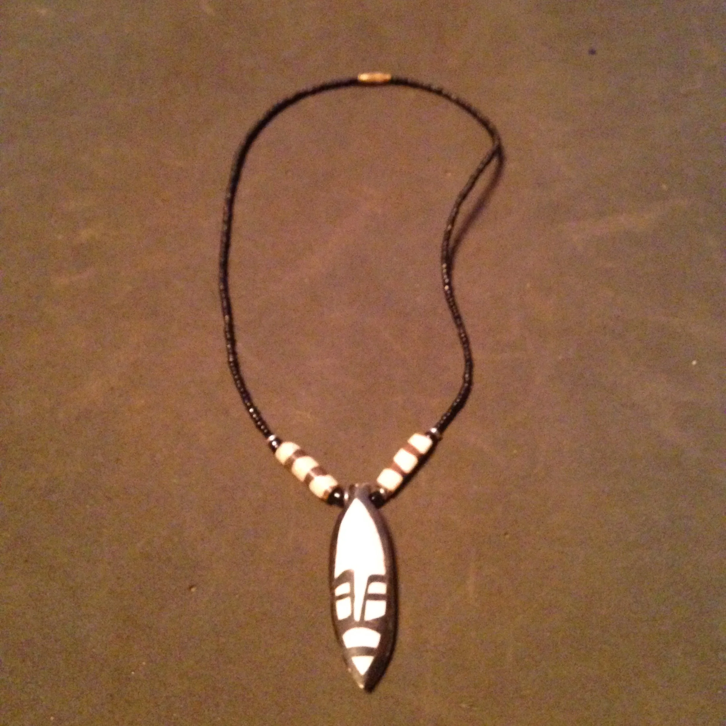 Carved face bone necklace 