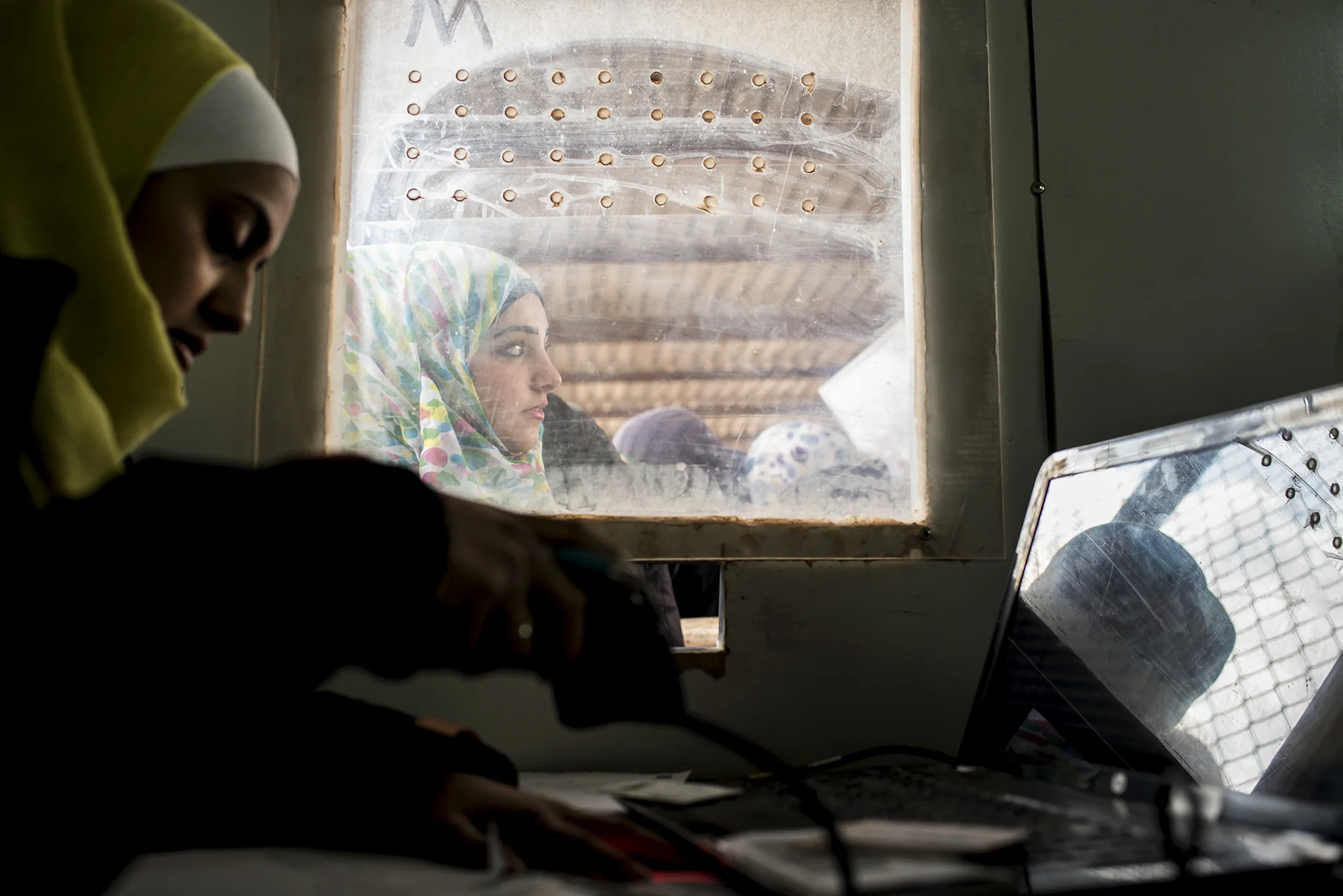 A Syrian refugee looks on while being registered with the Norwegian Refugee Council for services in Jordan's Zaatari Refugee Camp, six miles from Jordan's northern city of Mafraq, in February 2015.