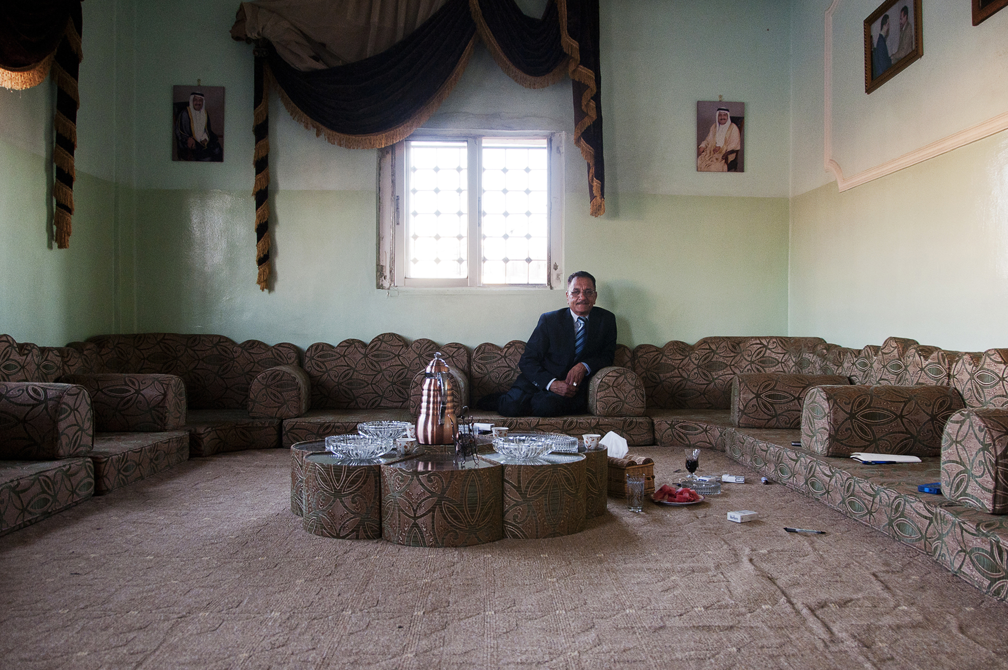 Moussa sits in his living room in east Amman. He is among one of the few educated and financially stable members of Jordan's Bani Murra. His family is widely-respected in the country because of his father's long musical career as a lute player. Musical performance is among the tribe's most well-known historical attributes, but Moussa's father was the last tribes-person to become nationally recognized. July 2013.