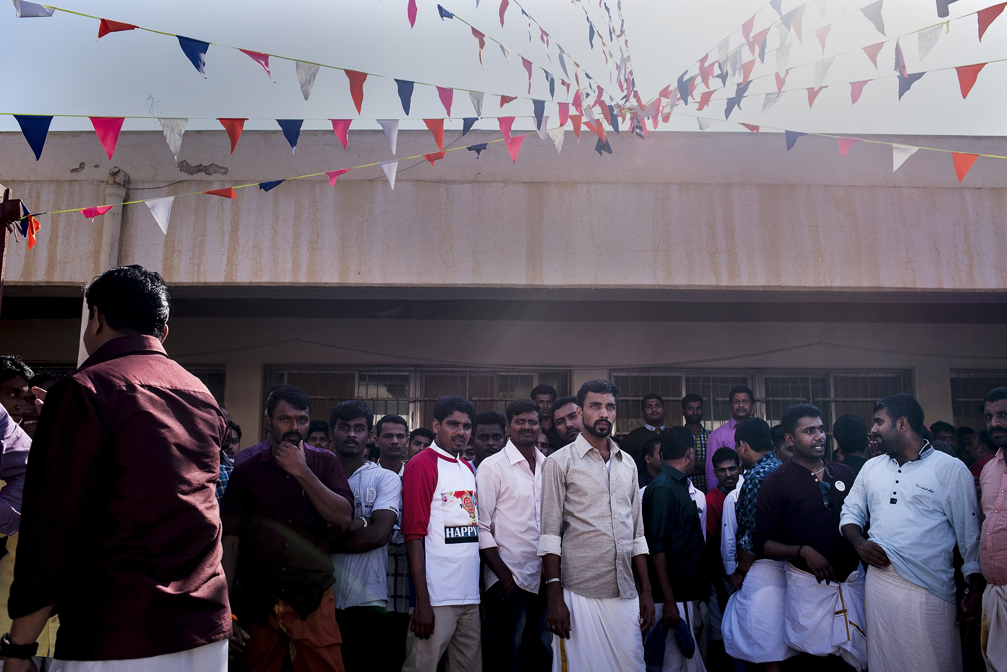 A worker prepares for a new round of tug-of-war, one of the Onam festival's activities. 