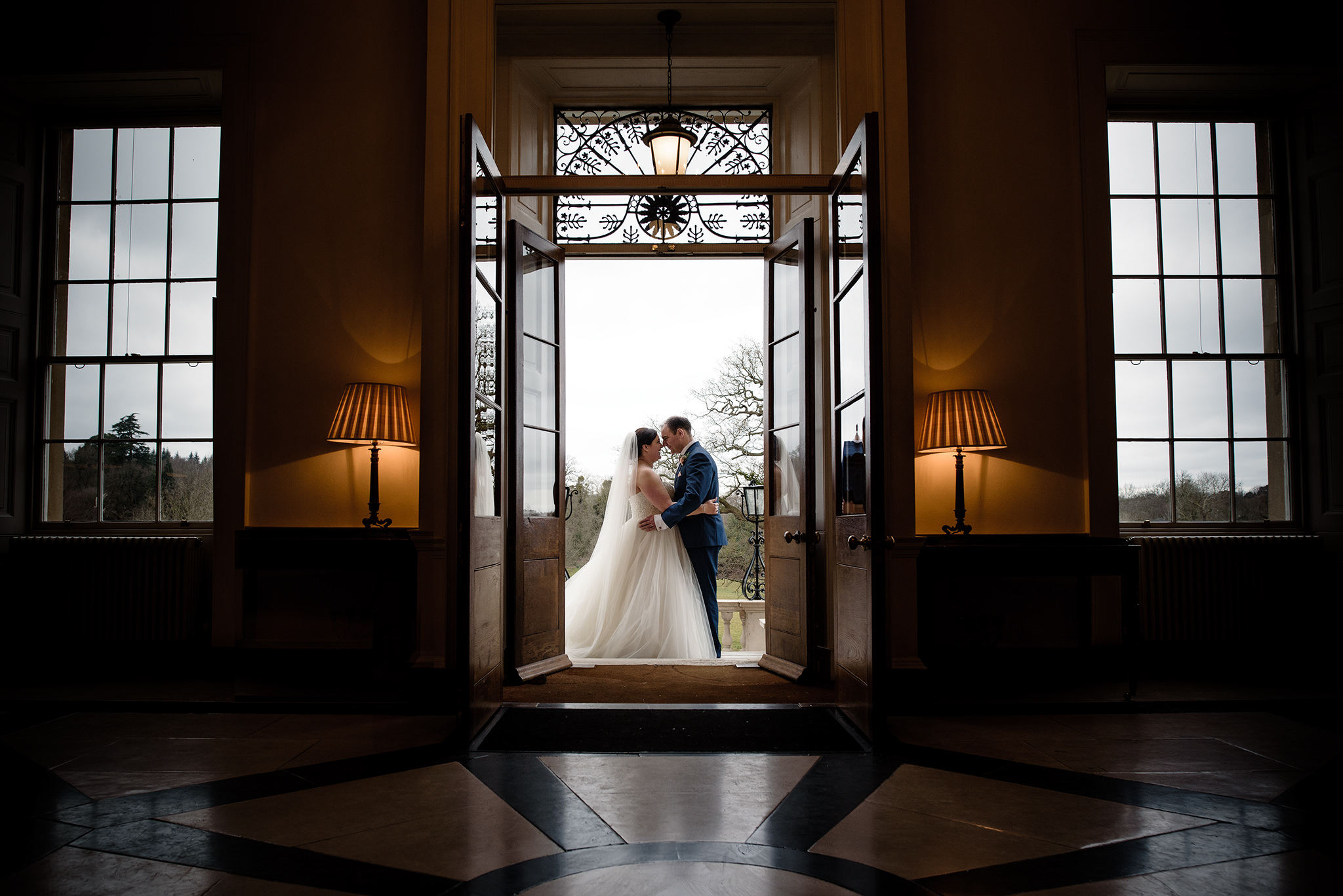 Bride and groom doorway portrait at botleys mansion