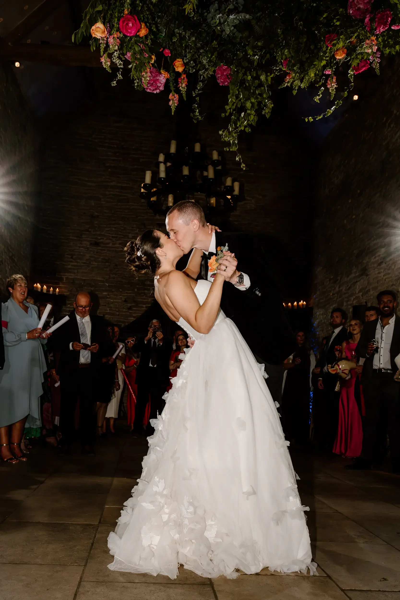 Bride and groom share a dippy kiss during their first dance at Stone Barn