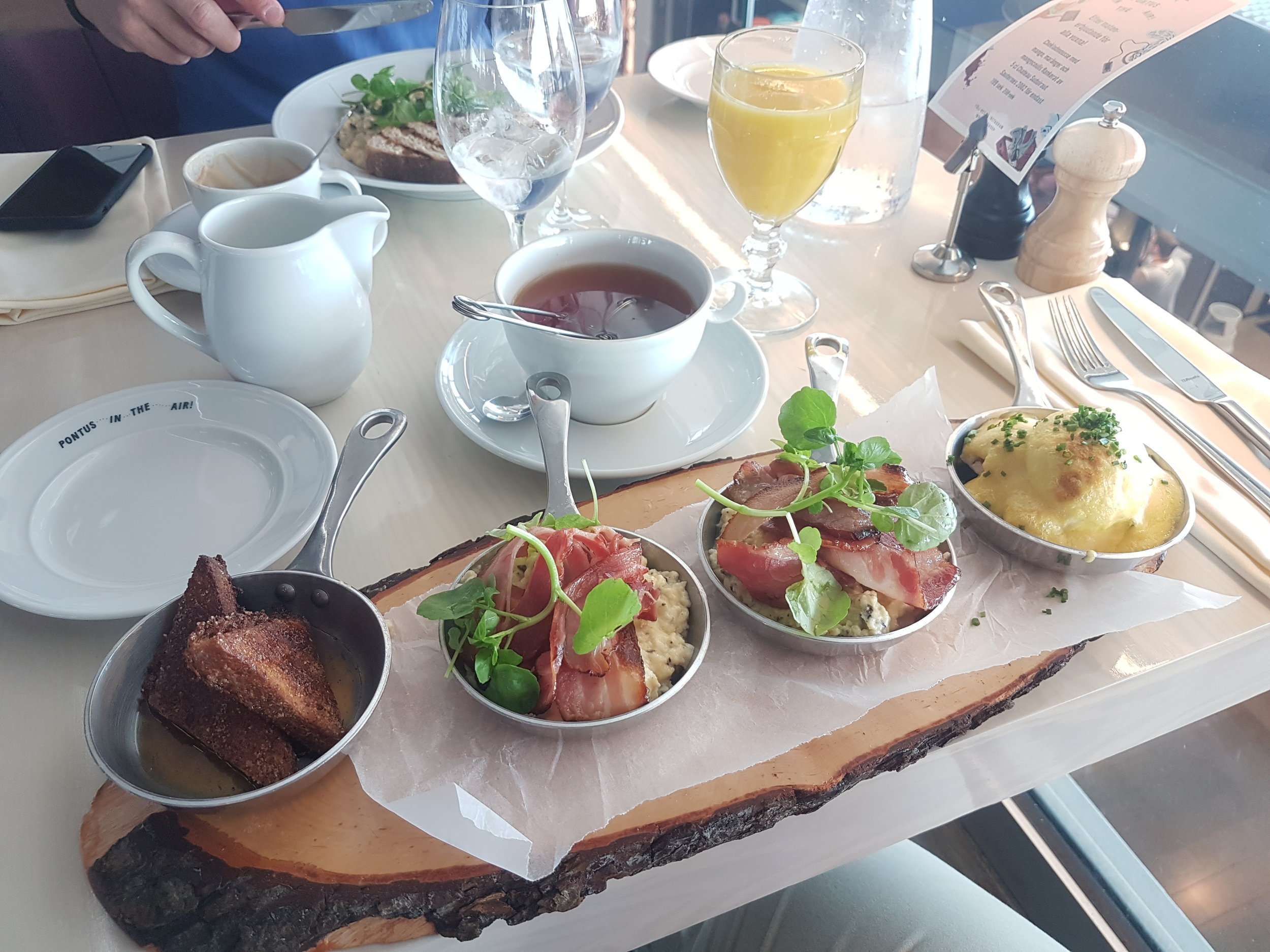 Captains Choice - French Toast, Two bowls of truffle scramble eggs with bacon and a Egg benedict with lobster
