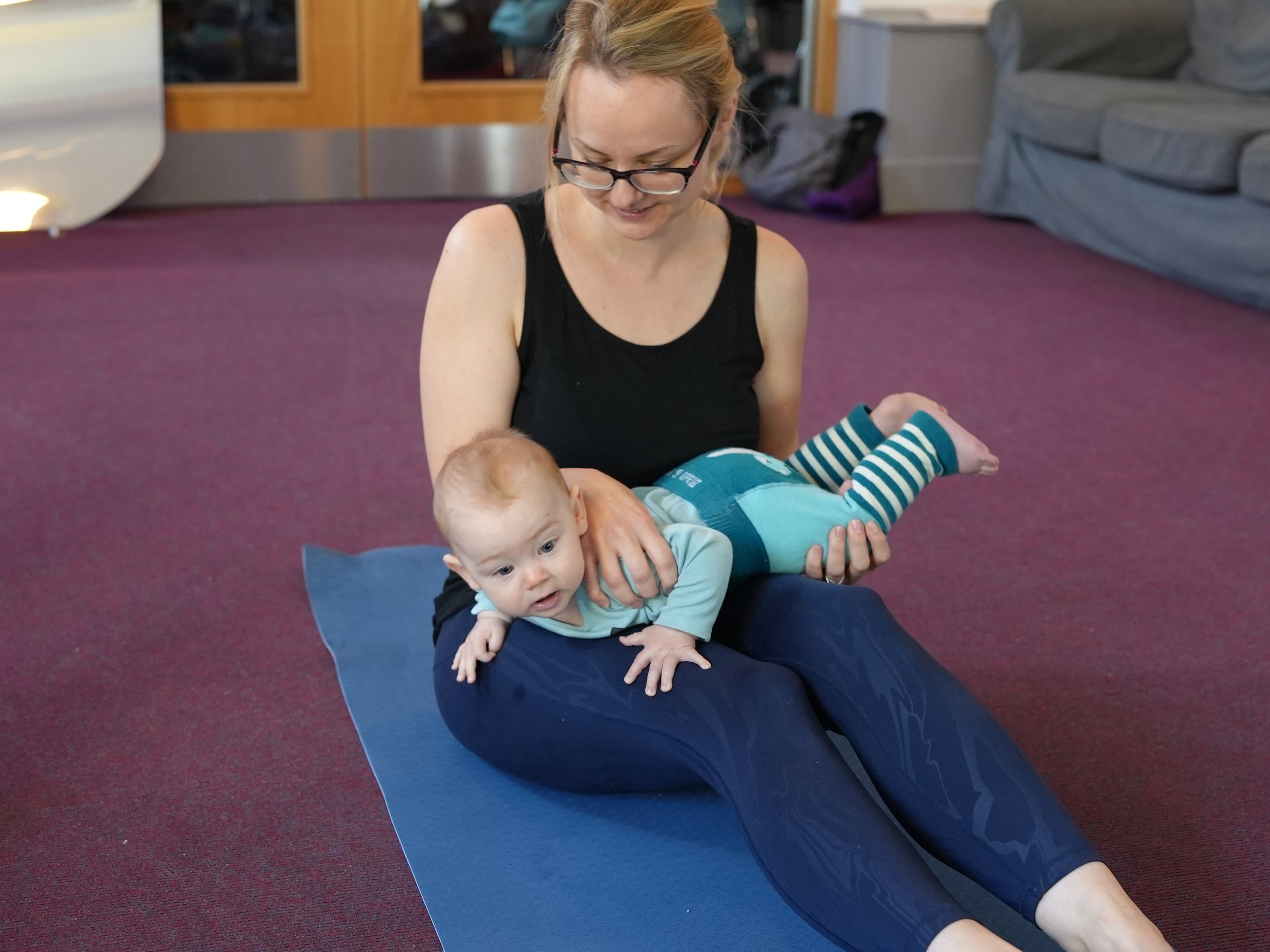  Baby is across his mums knees in Indian bounding. This is a secret tummy time move 