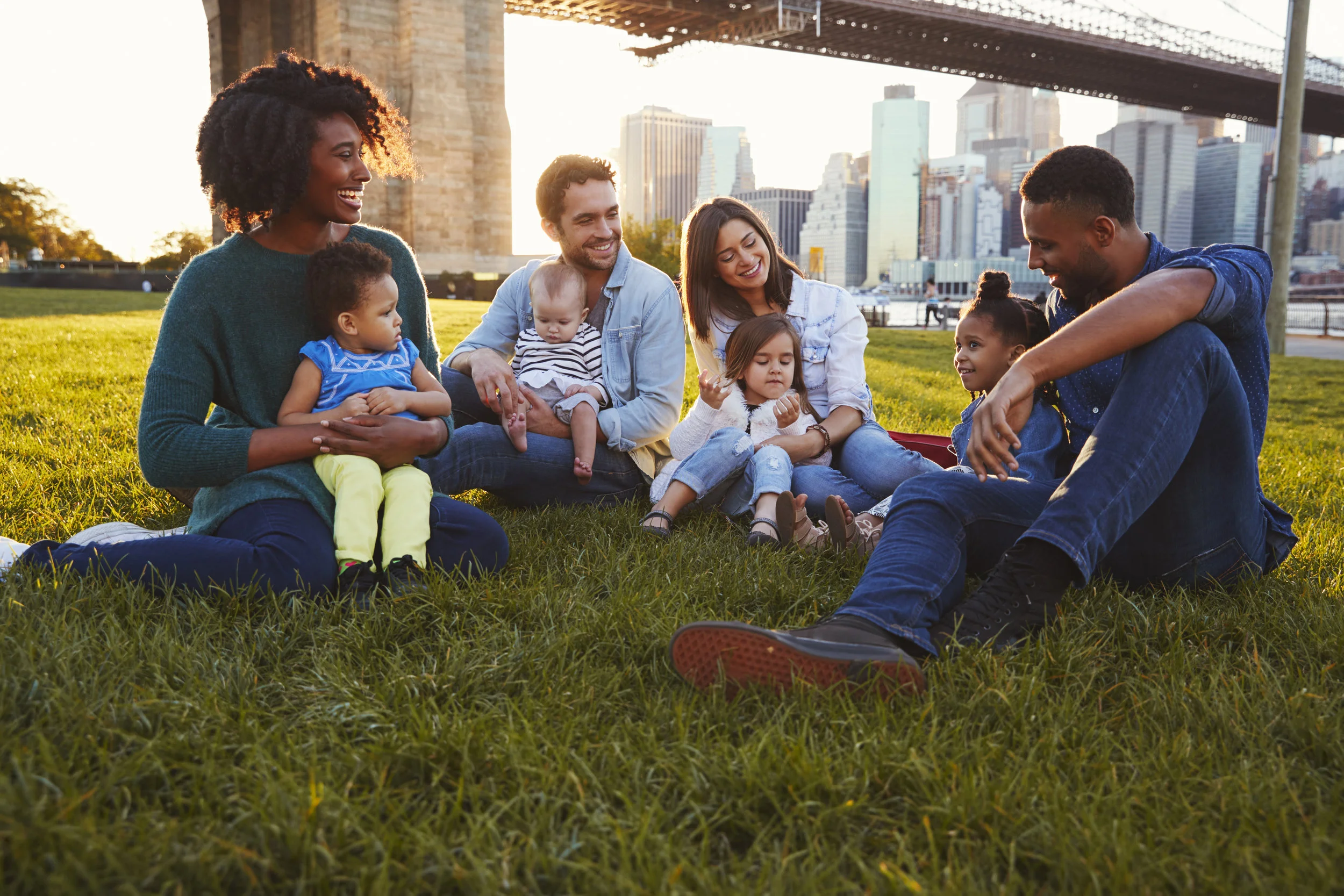 Two-families-with-daughters-sitting-on-lawn-901214910_3869x2579.jpeg