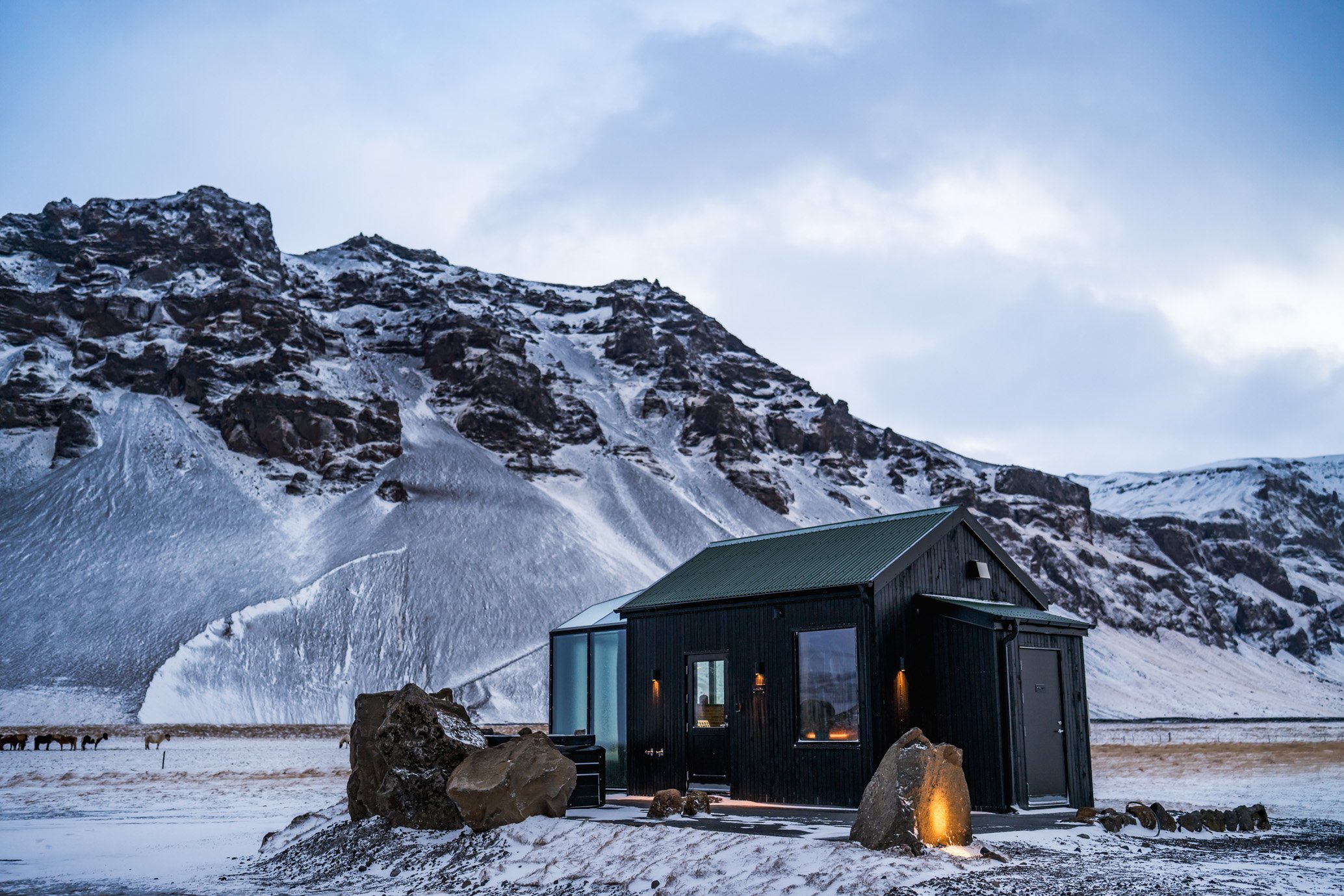 Luxury glass cabin at Sky Retreat Iceland during sunset in winter, an exclusive honeymoon stay by Darren Thomas Photography.