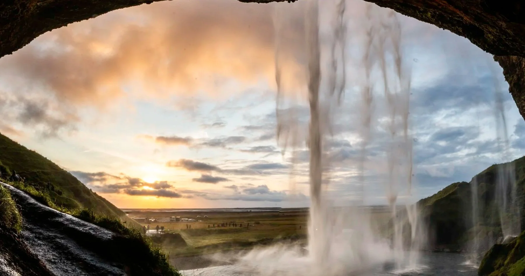 Bride and groom enjoying a sunset at Sky Retreat Iceland glass cabin during a winter elopement.