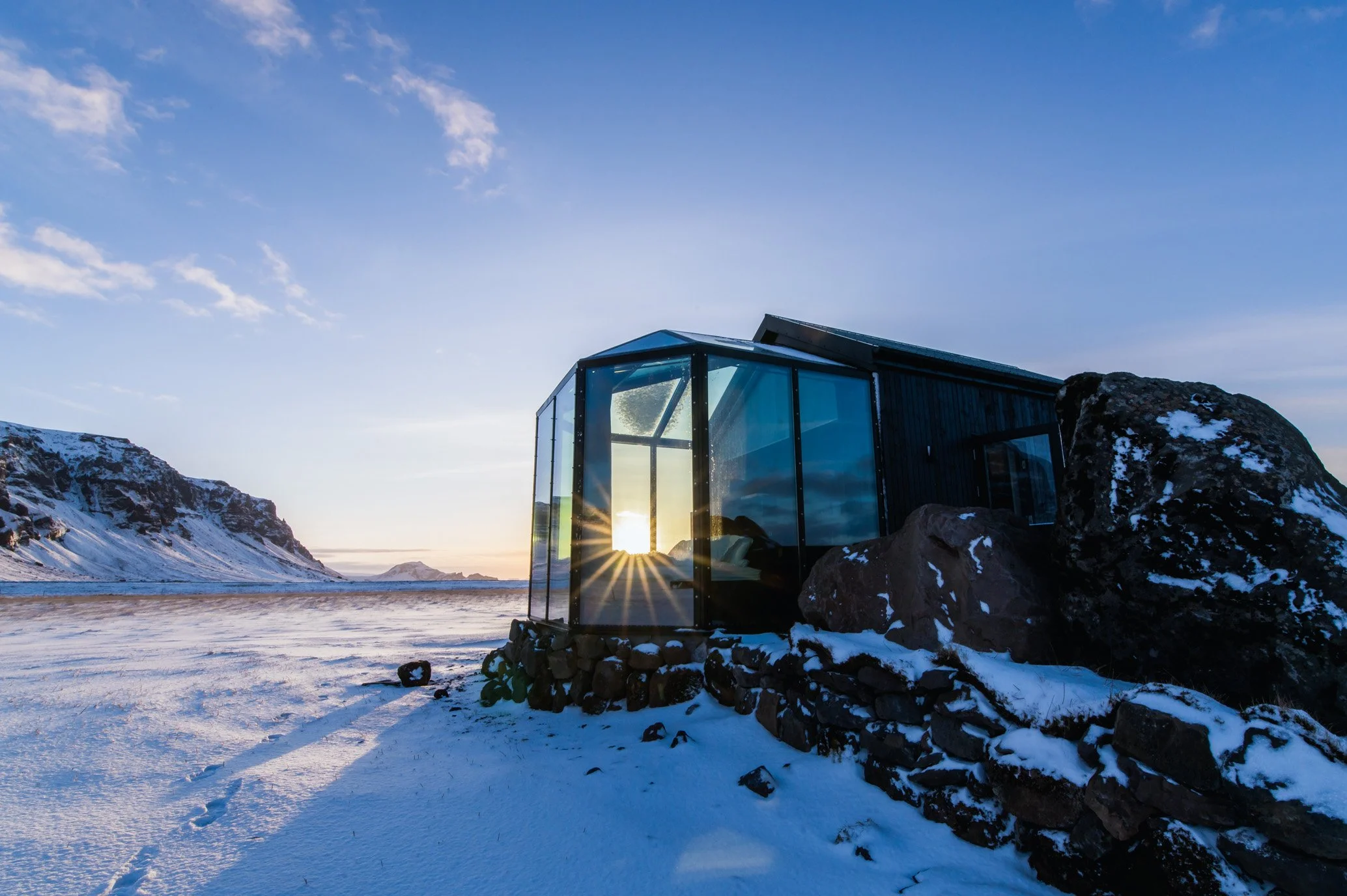 Luxury glass cabin at Sky Retreat Iceland during sunset in winter, an exclusive honeymoon stay by Darren Thomas Photography
