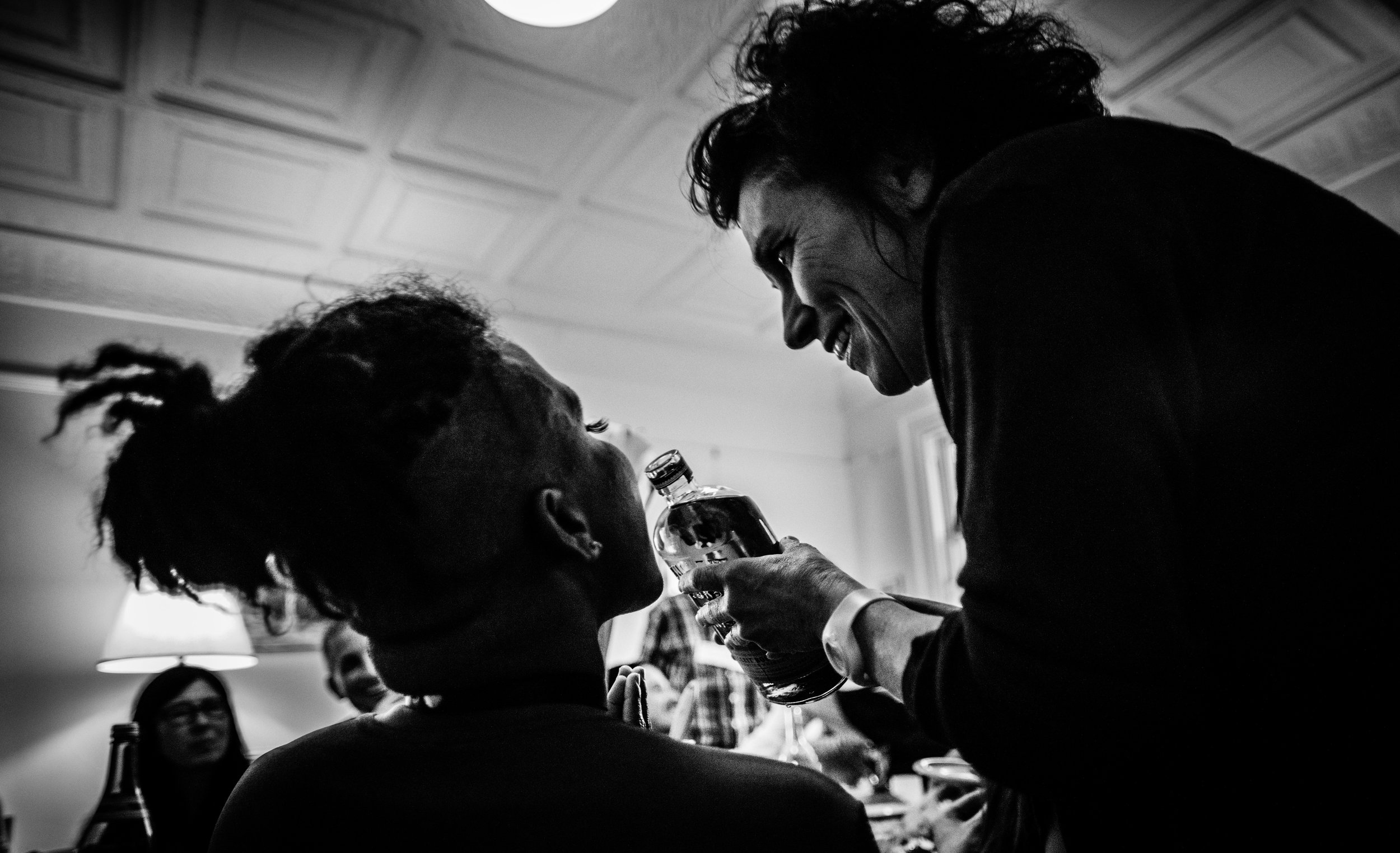 Carolyn offers Jose some whiskey during the 'Dinner Gallery' of For You. Photo by: Robbie Sweeny. 