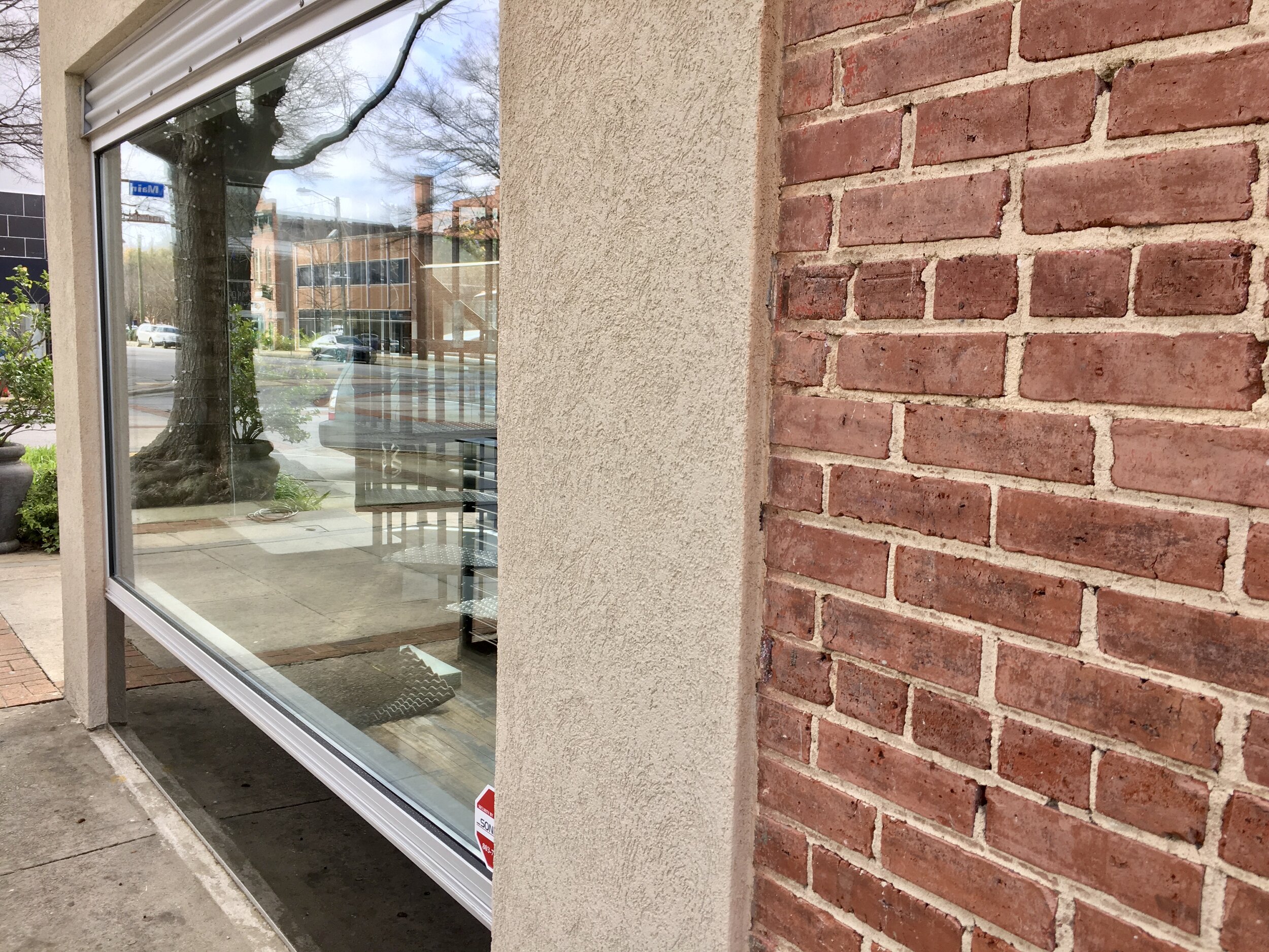  Store front facade works well on top of the solid brick wall 