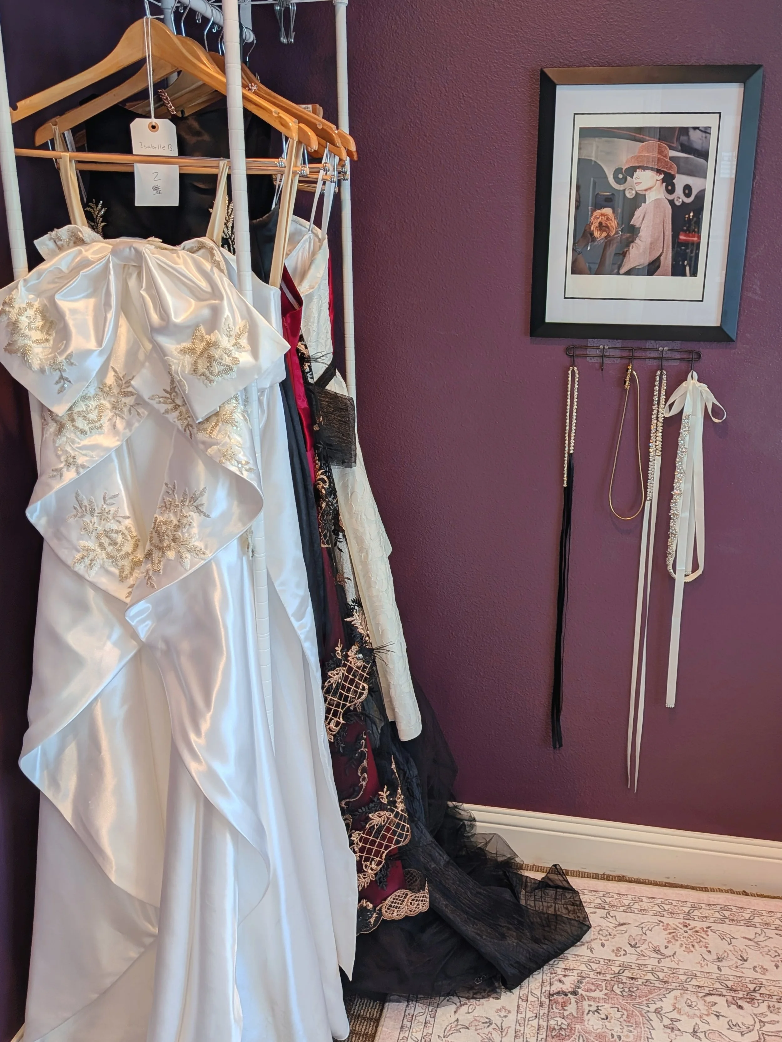 Romantic dressmakers studio featuring satin bridal gowns and refined, vintage‑inspired details