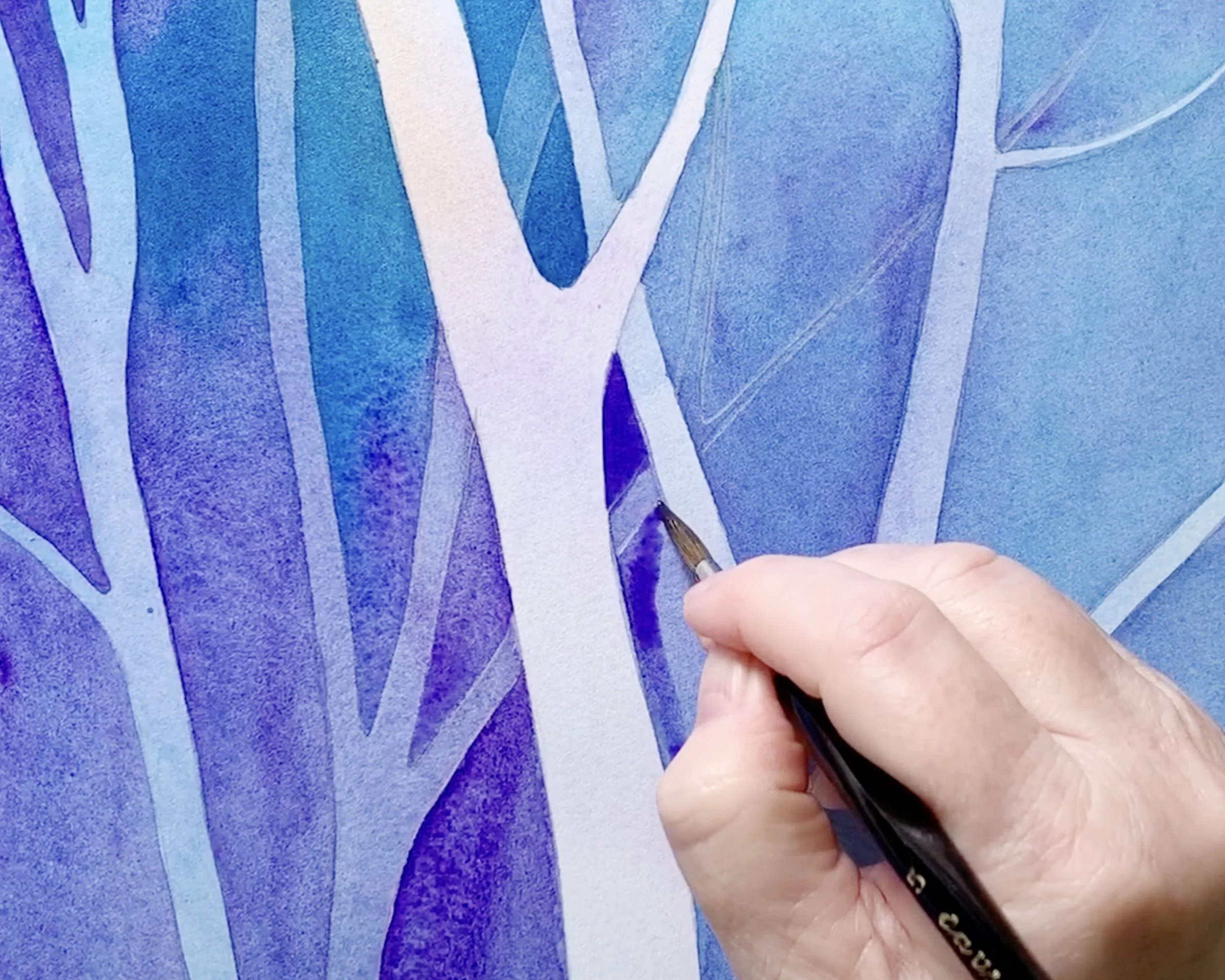 Close up of negative painting in watercolour with white tree trunks preserved against layered blue and purple washes.