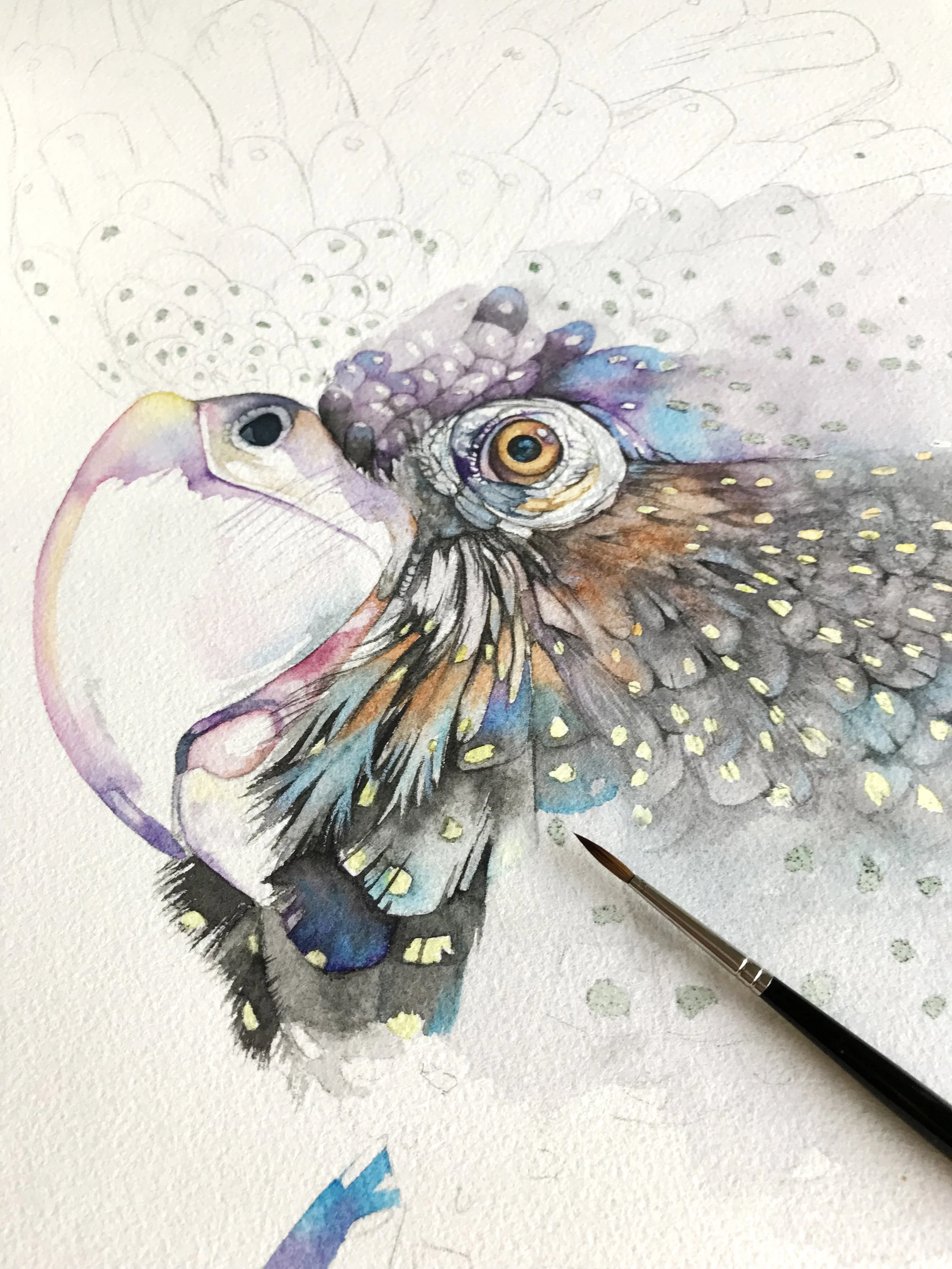 Detailed watercolour bird painting in progress with dark values around the eye and feathers creating depth.