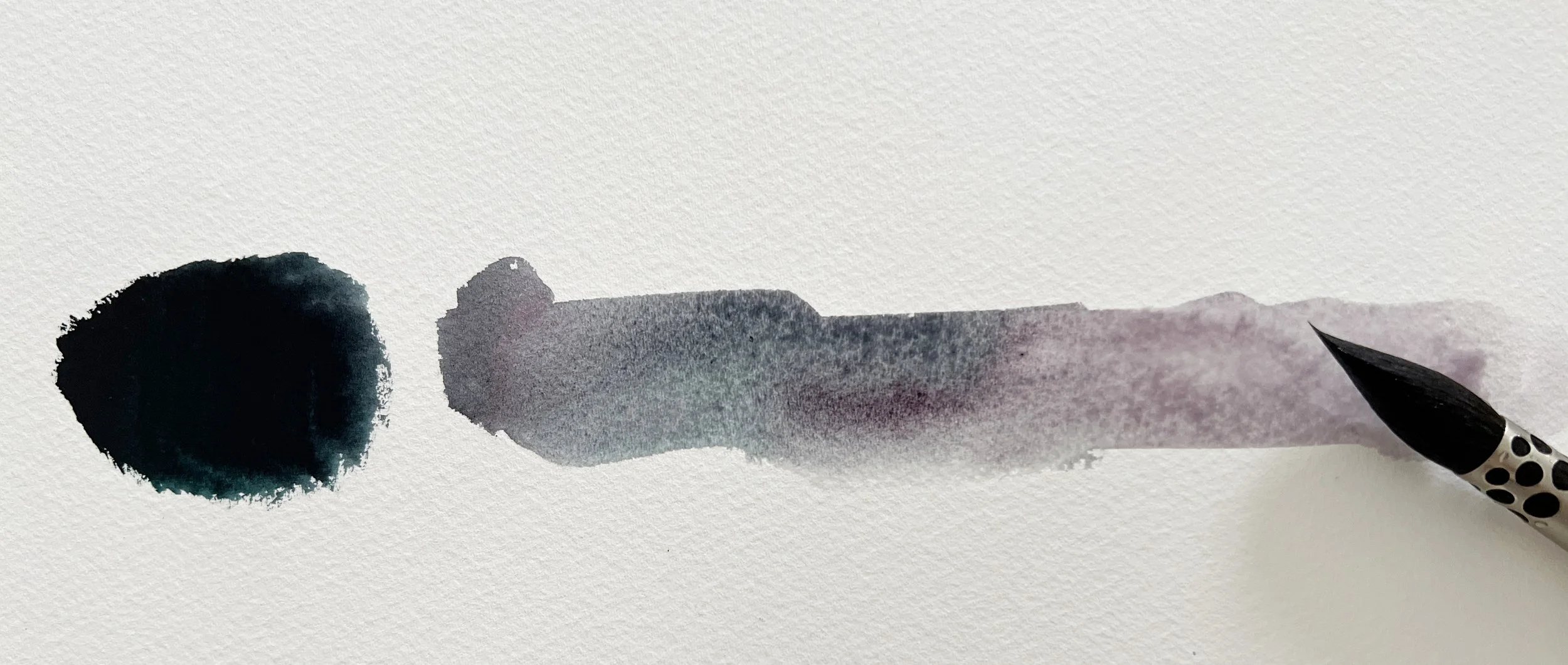 A watercolour gradient transitioning from a deep black to soft violet-grey, painted with a large round brush.