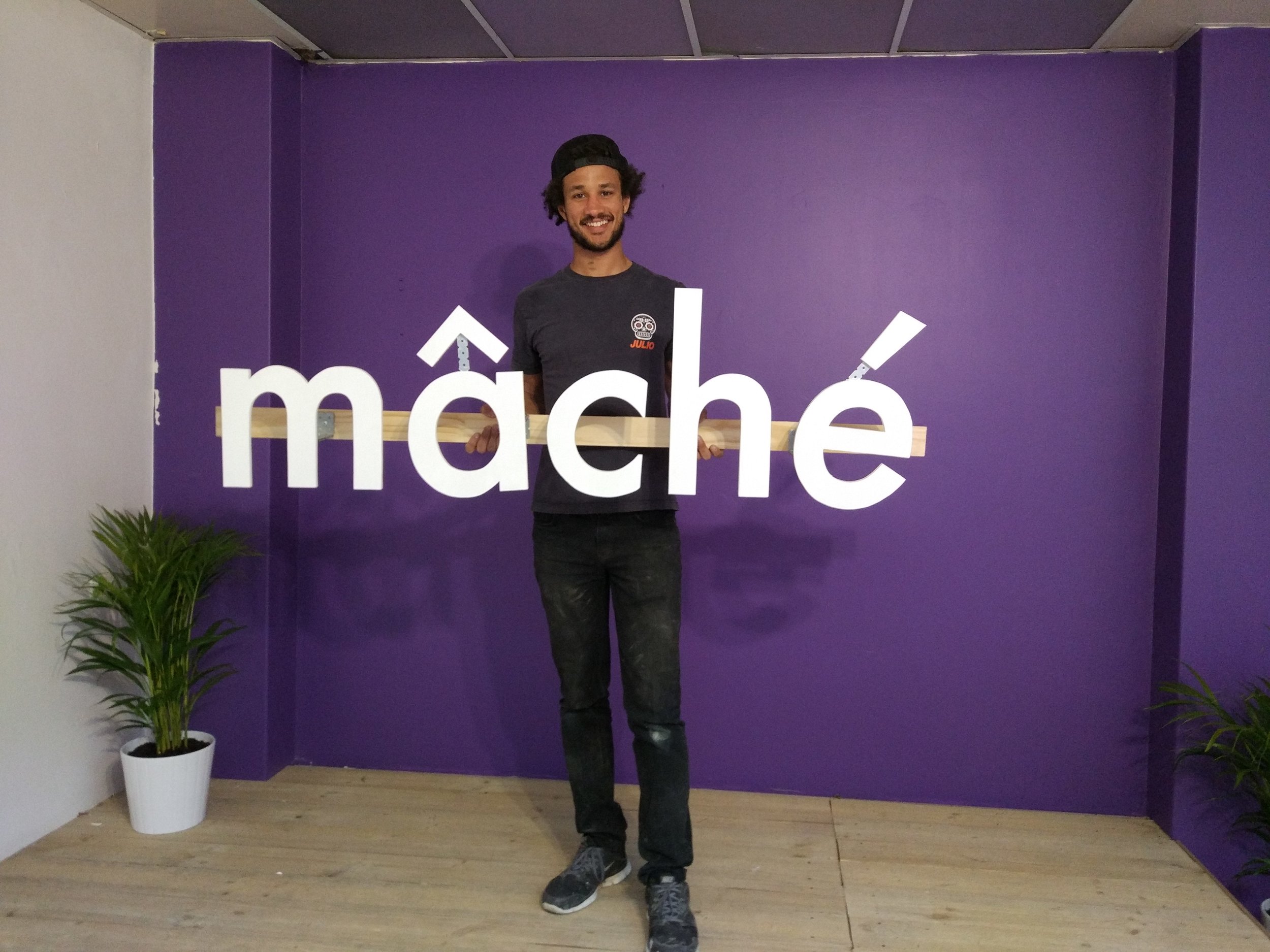 Dans, ready to mount the sign, looking pretty pleased