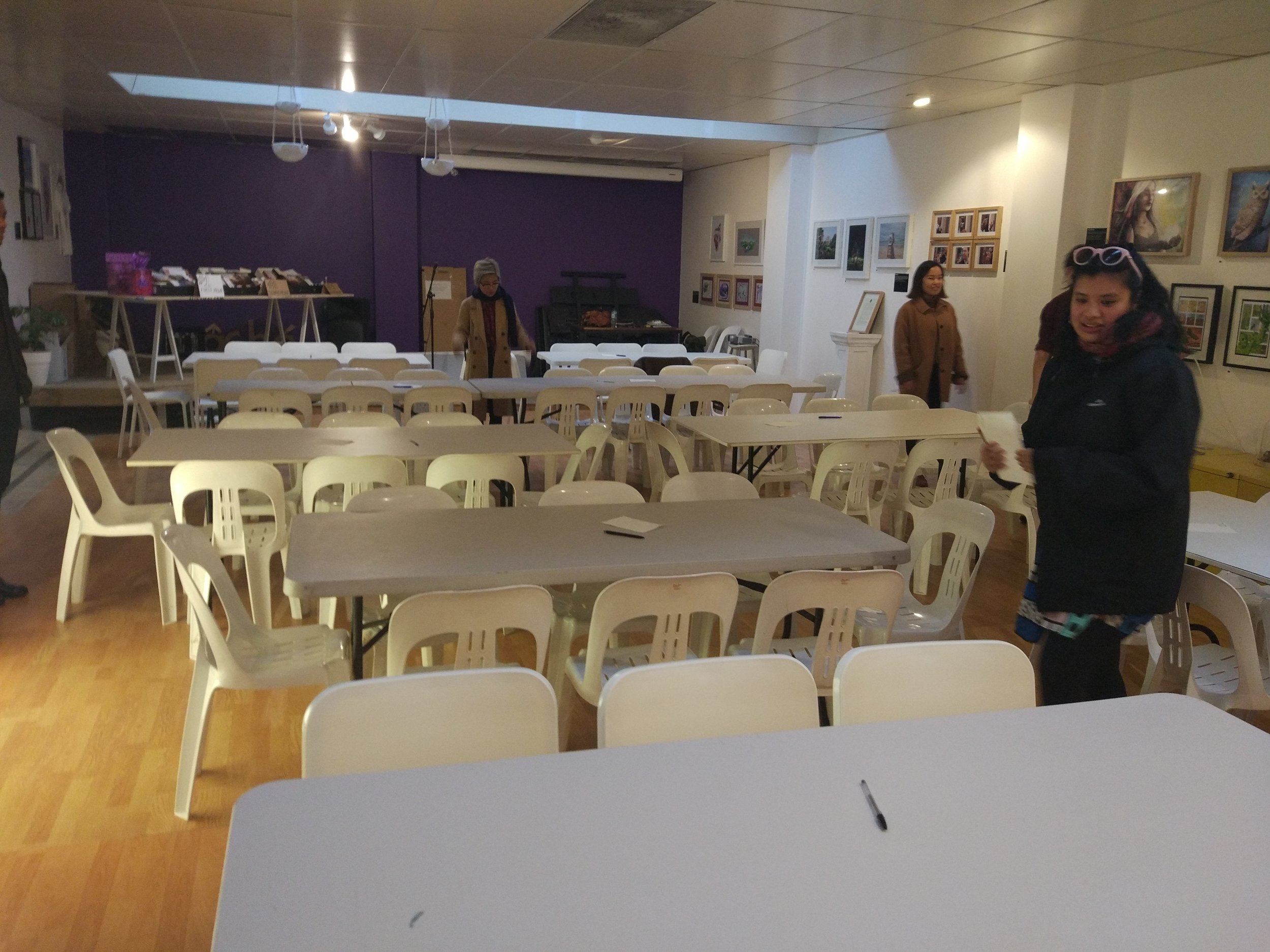 The Adelaide Uni Art History Club deep in concentration as they work out their quiz night arrangements