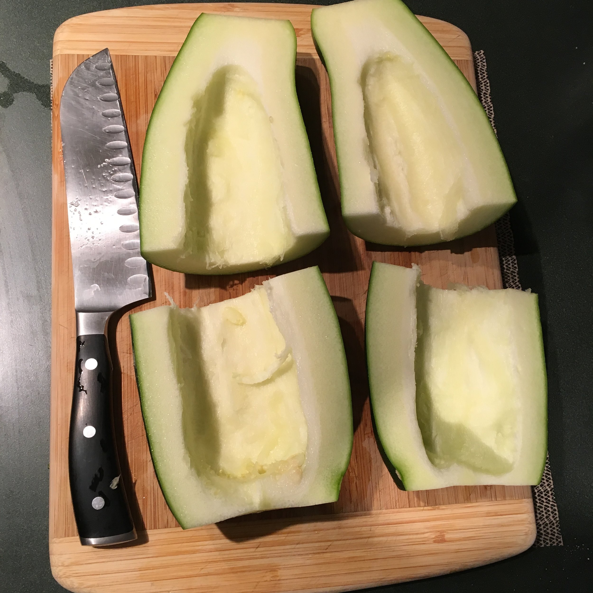 In smaller zucchini, the seeds generally don't need to be removed, but that's a 7" blad santoku knife pictured, so I definitely removed the seeds on this guy!