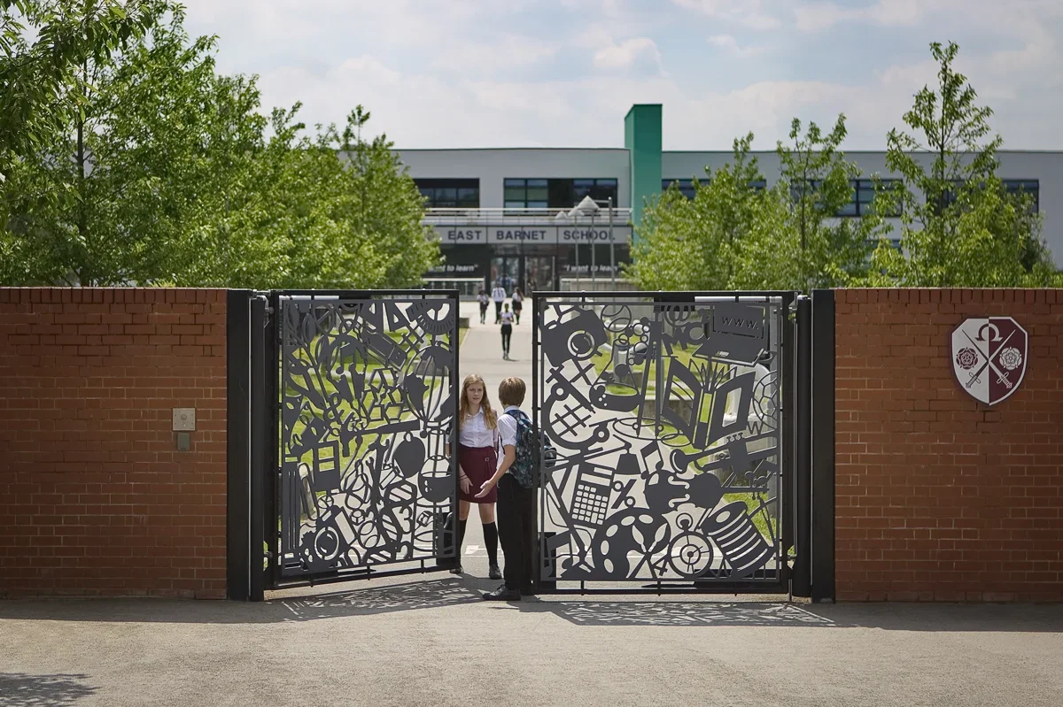 East+Barnet+Secondary+School+Gates+by+Lara+Sparey,++pedestrian+gates+forming+the+entrance+to+the+new+school+building.webp