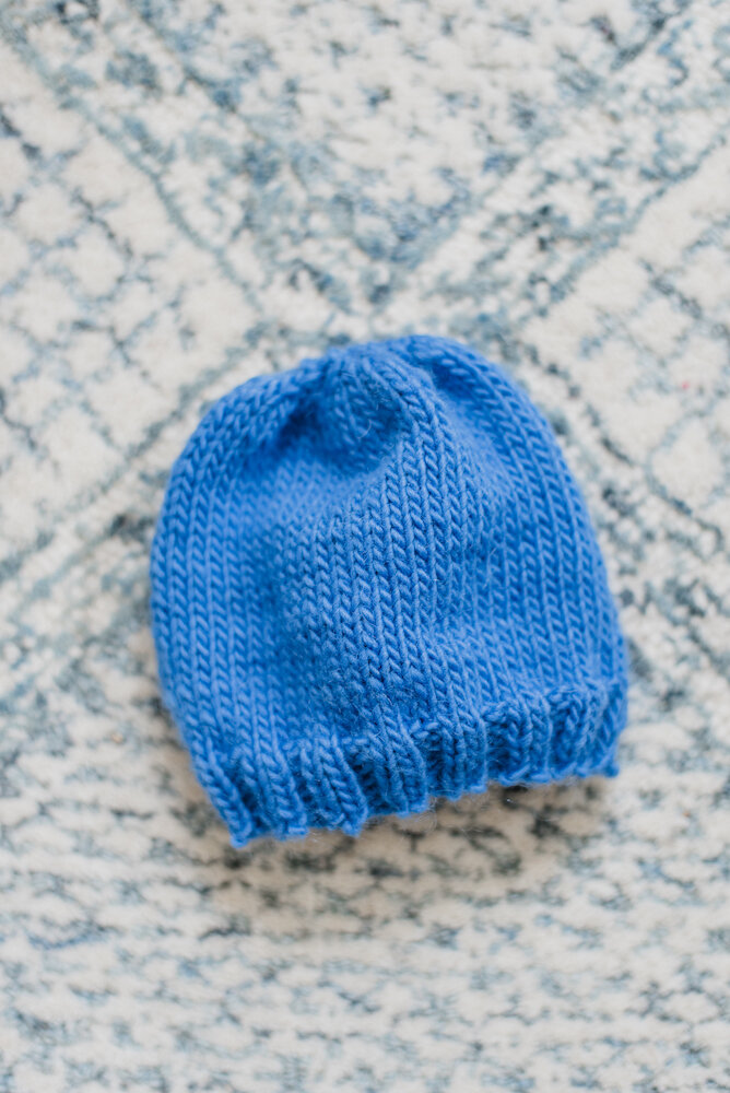 Blue knitted baby hat