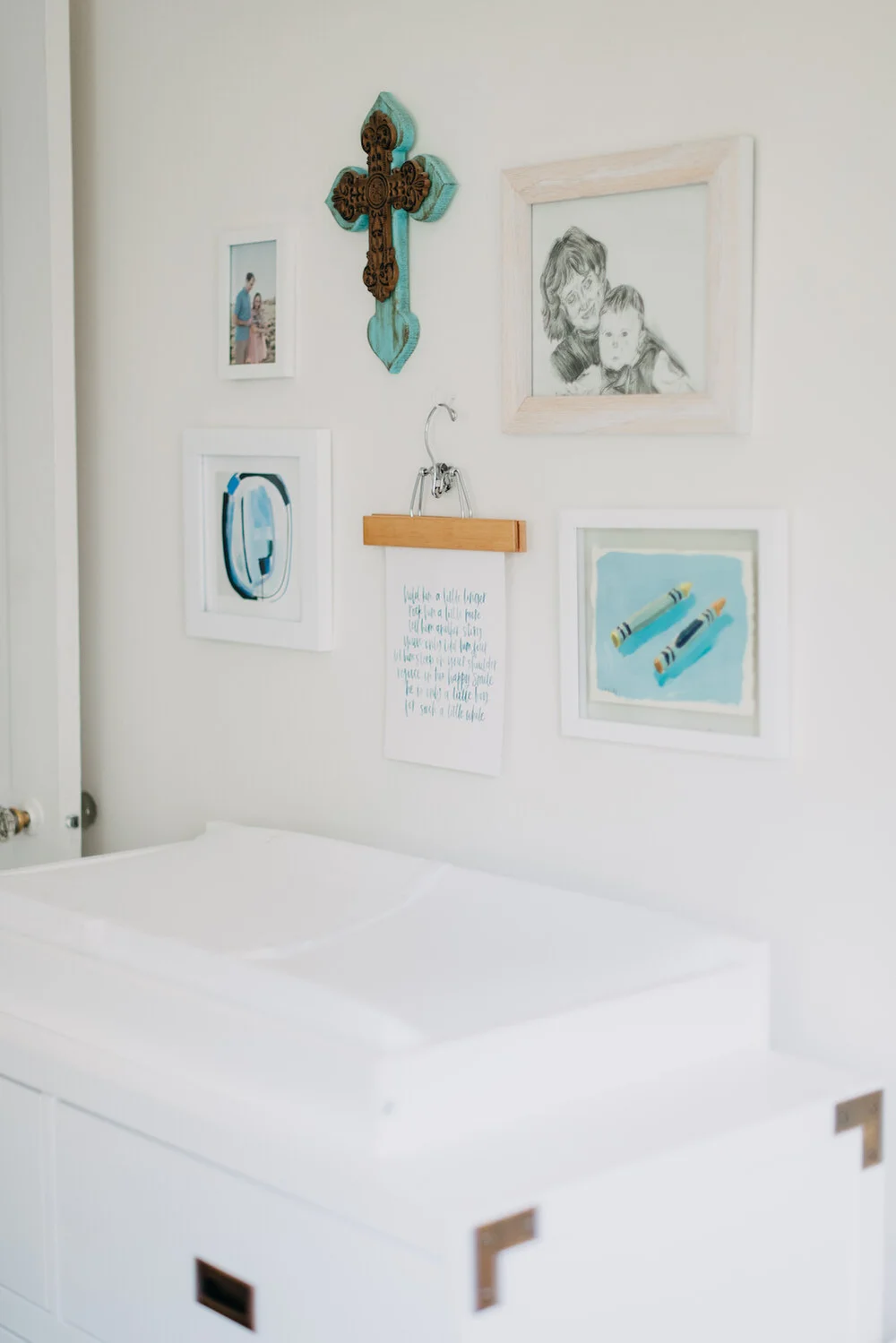 Nursery gallery wall and changing table