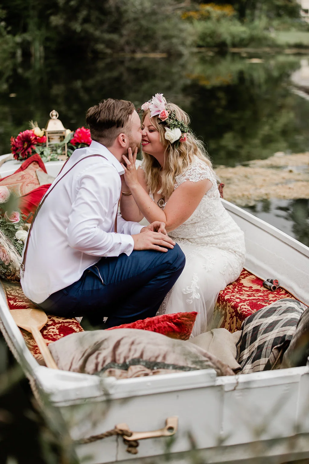 Our refurbished boat was a labour of love. We hauled it out of a field where it had been sitting for years but with a good long power wash and coat of paint, we turned it into a romantic setting for some of our best wedding pictures. Couch cushions thrown in on the day of made it even better!
