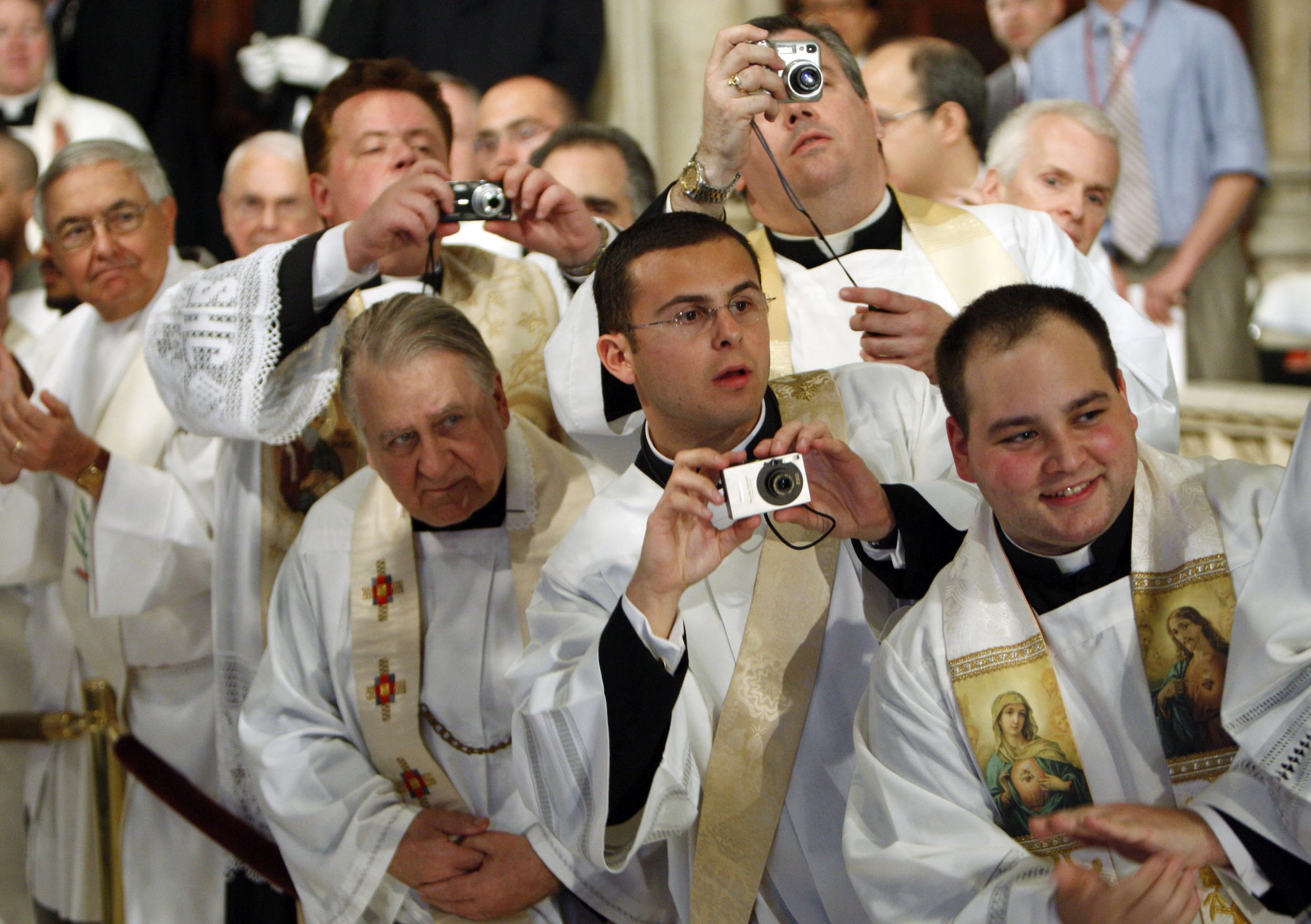  Clergy members wait to catch a glimpse of Pope Benedict XVI after mass Saturday, April 19, 2008 at St. Patrick's Cathedral in New York. 