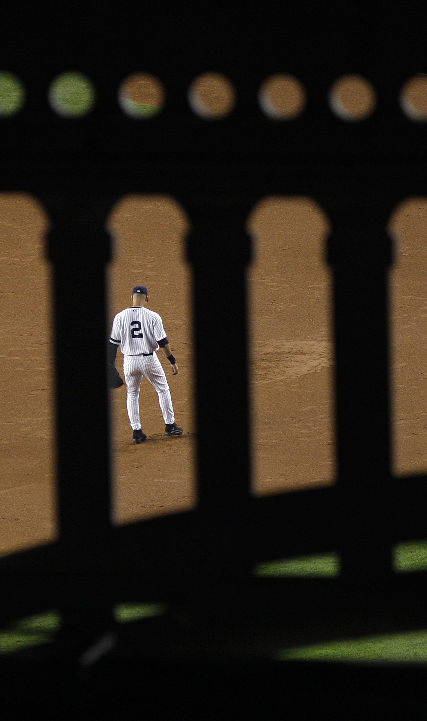  Yankees’ captain Derek Jeter is seen through the iconic stadium latticework during the last home game in the House That Ruth Built Sunday, Sept. 21, 2008. 