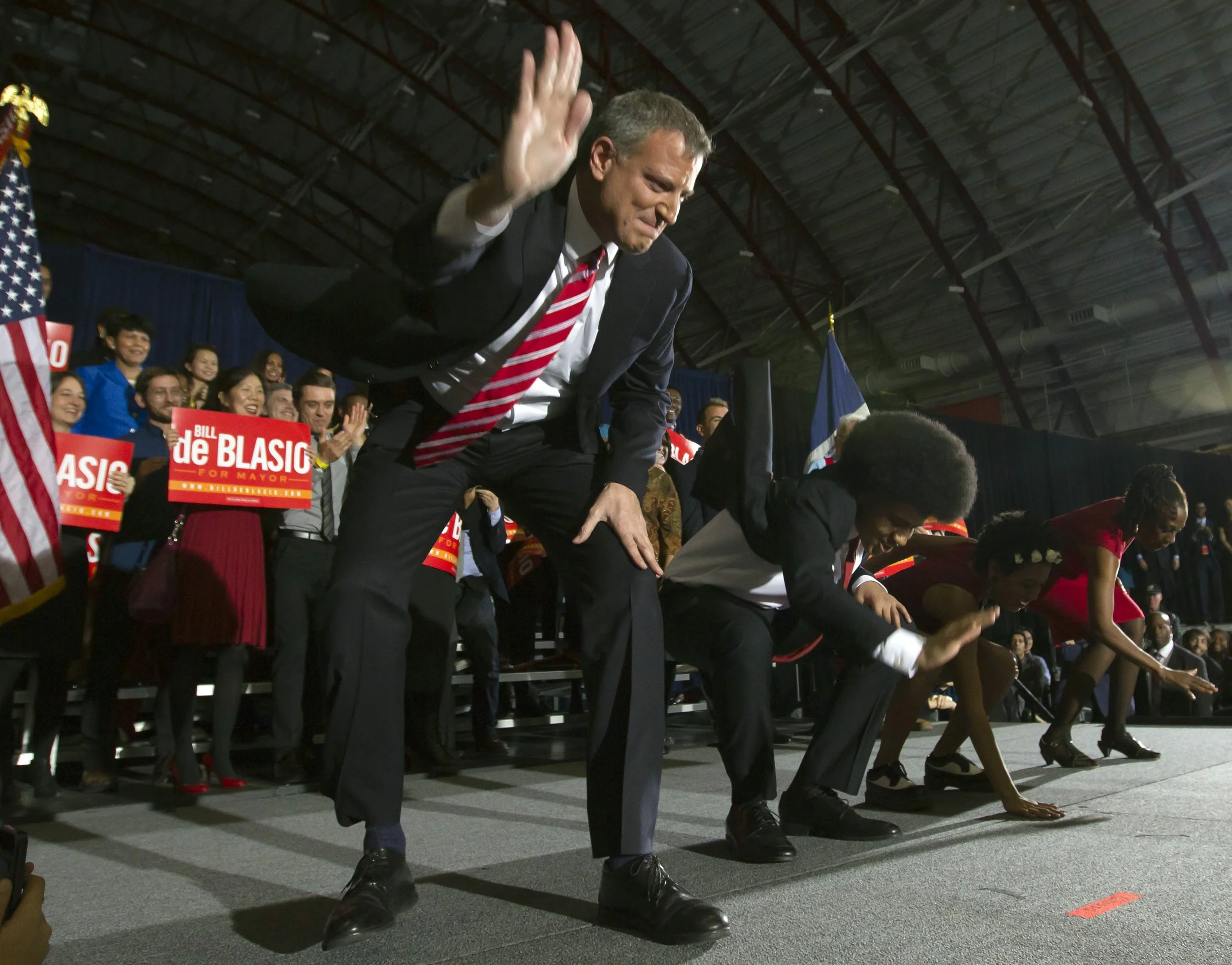 New York mayor-elect Bill de Blasio and his family perform their celebratory "smackdown" dance on Election Night Tuesday, Nov. 5, 2013, at the Park Slope Armory YMCA, in Brooklyn. 