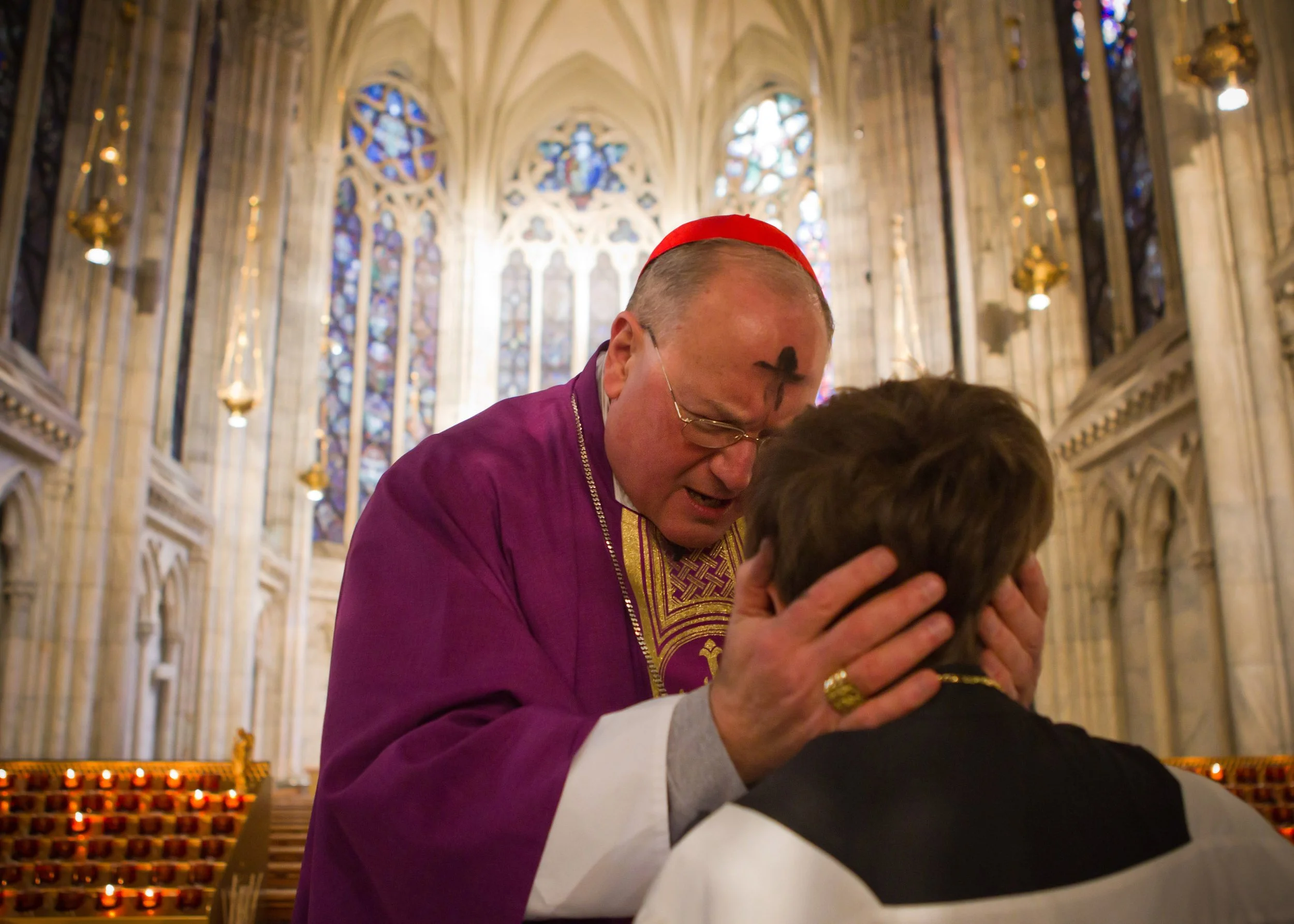  Cardinal Timothy Dolan blesses altar boy Chris Sweeney, 10, of Staten Island, after the Ash Wednesday service Wednesday, Feb. 22, 2012, at St. Patrick's Cathedral in New York. Dolan was elevated to Cardinal by Pope Benedict XVI last week.  