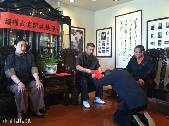 Student J. Matthew Brand bows to Master Hu.