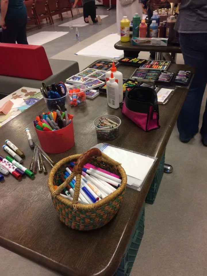 Our participants were well-supplied as they started their experience with body mapping!Image description: a table of art supplies