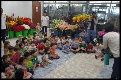 Auntie Agnes explained to the children how flowers are coloured.