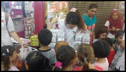 The children were eager to choose their bindis.