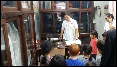 The tailor used a sewing machine for efficiency.