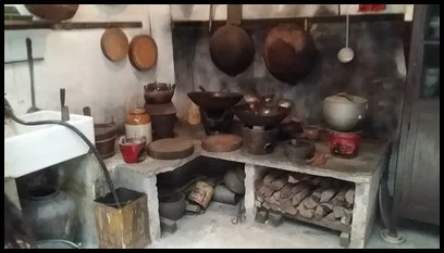 Kitchens were usually located at the back of the shophouse. Wood was used to start the fire for cooking.