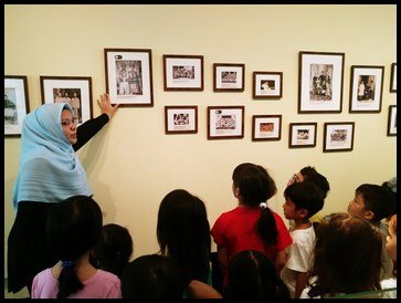  Mrs. Rila showed the children a photo of a couple dressed in their traditional wedding garb. On this joyous occasion, the bride and the groom become "king and queen for a day" and are treated like royalty. 