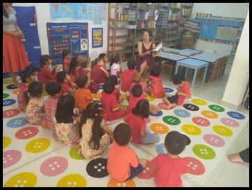  Mrs. Geraldine read the Chinese New Year story to those who had finished. 