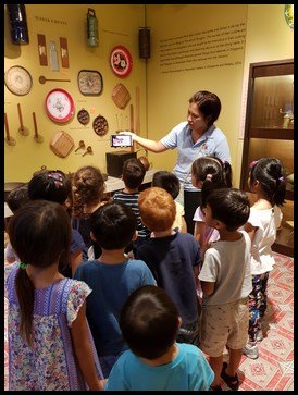  As many of them have not seen "kueh rose" before, Ms. Kristine showed them a short clip of the labour intensive process of making them using the brass moulds and the wok. 