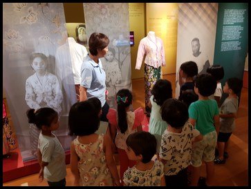  Mrs. Jo introduced the traditional women's attire - the "sarong kebaya" which is adorned by beautiful patterns and embroidery. 