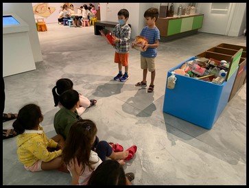  The last activity required the children to pick a food packaging and sort it according to its material. Once they had picked, the children showed their friends and placed them accordingly. 