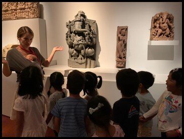  Mrs Natalia took the children to the next artefact which was of the God Ganesha. They looked at one of the four-armed statue where Ganesha used its trunk to tuck into a bowl of sweetmeats. They pointed out a cobra on his tummy and were excited when 
