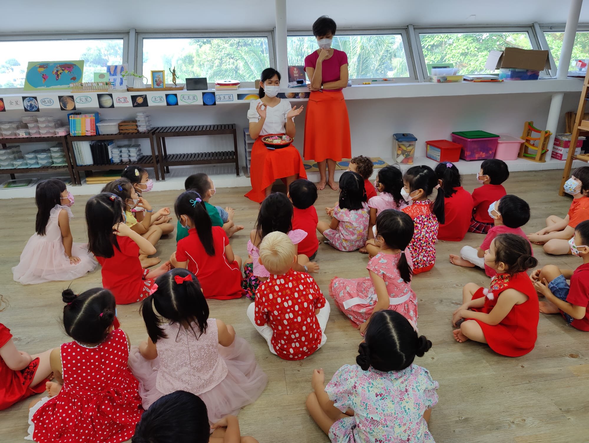  The candy tray was explained to the children. The tray is filled with things with meanings of joy and good health for the family. 