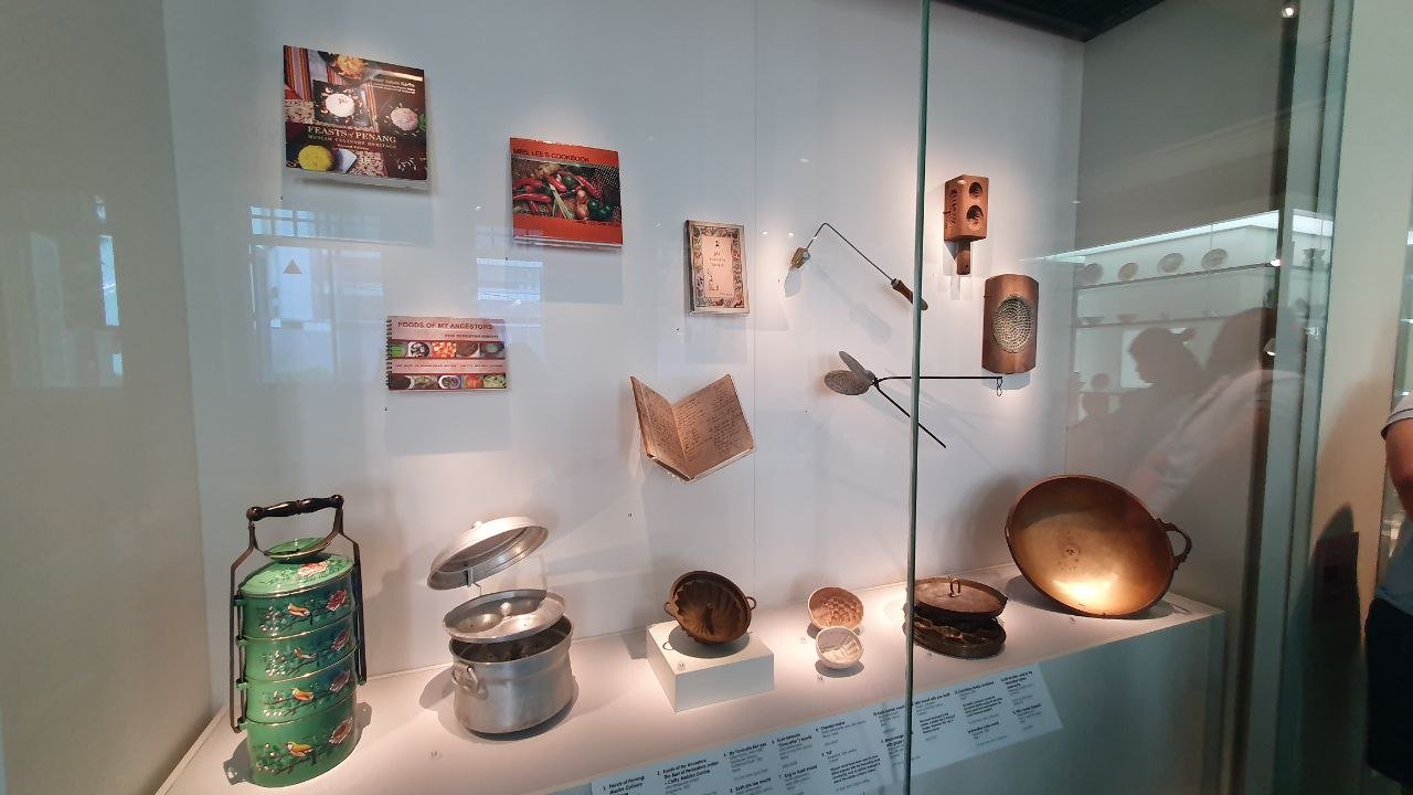  Cook books and utensils used in Peranakan cooking. 