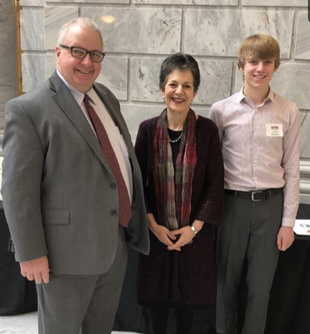 State History Director Brad Westwood, Rep. Arent, and Jacob Simmons