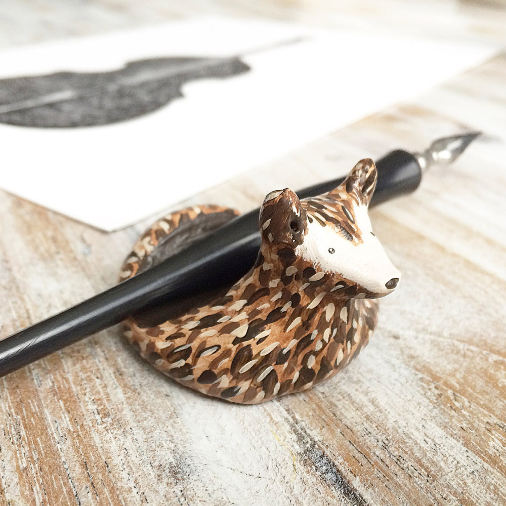 <p><strong><a href="https://www.etsy.com/listing/385486296/calligraphy-pen-rest-free-usa-shipping?ref=shop_home_active_4" target="_blank">Loosh Art's Clay Deer Pen Rest</a></strong></p>