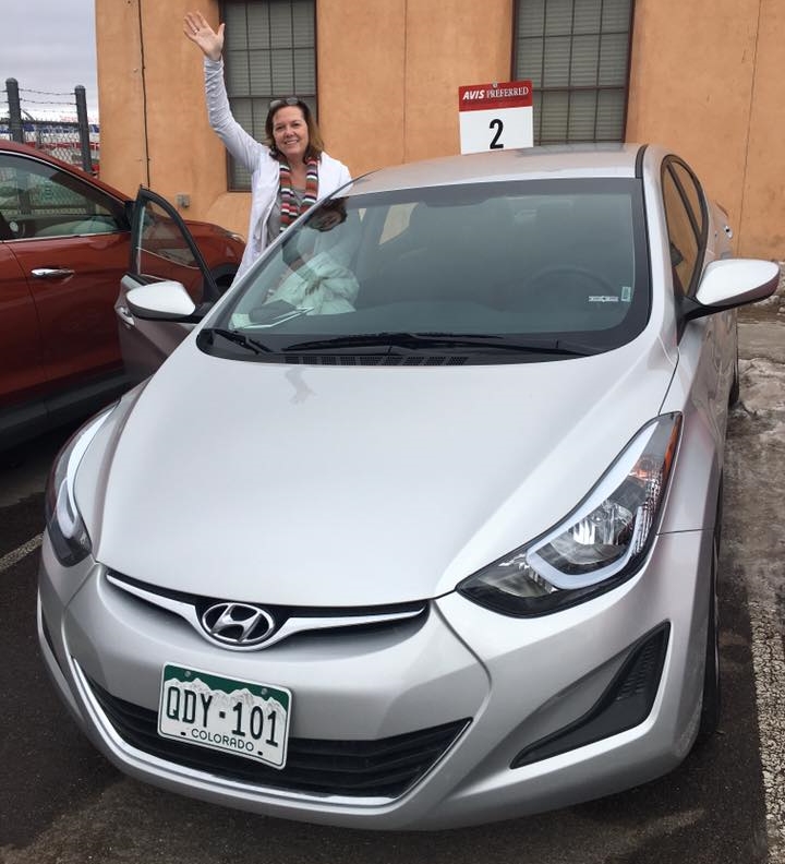 Dreamy Wife getting into the spirit of an unexpected 800-mile drive in the rarest of beasts: An available rental car in Sante Fe, NM.