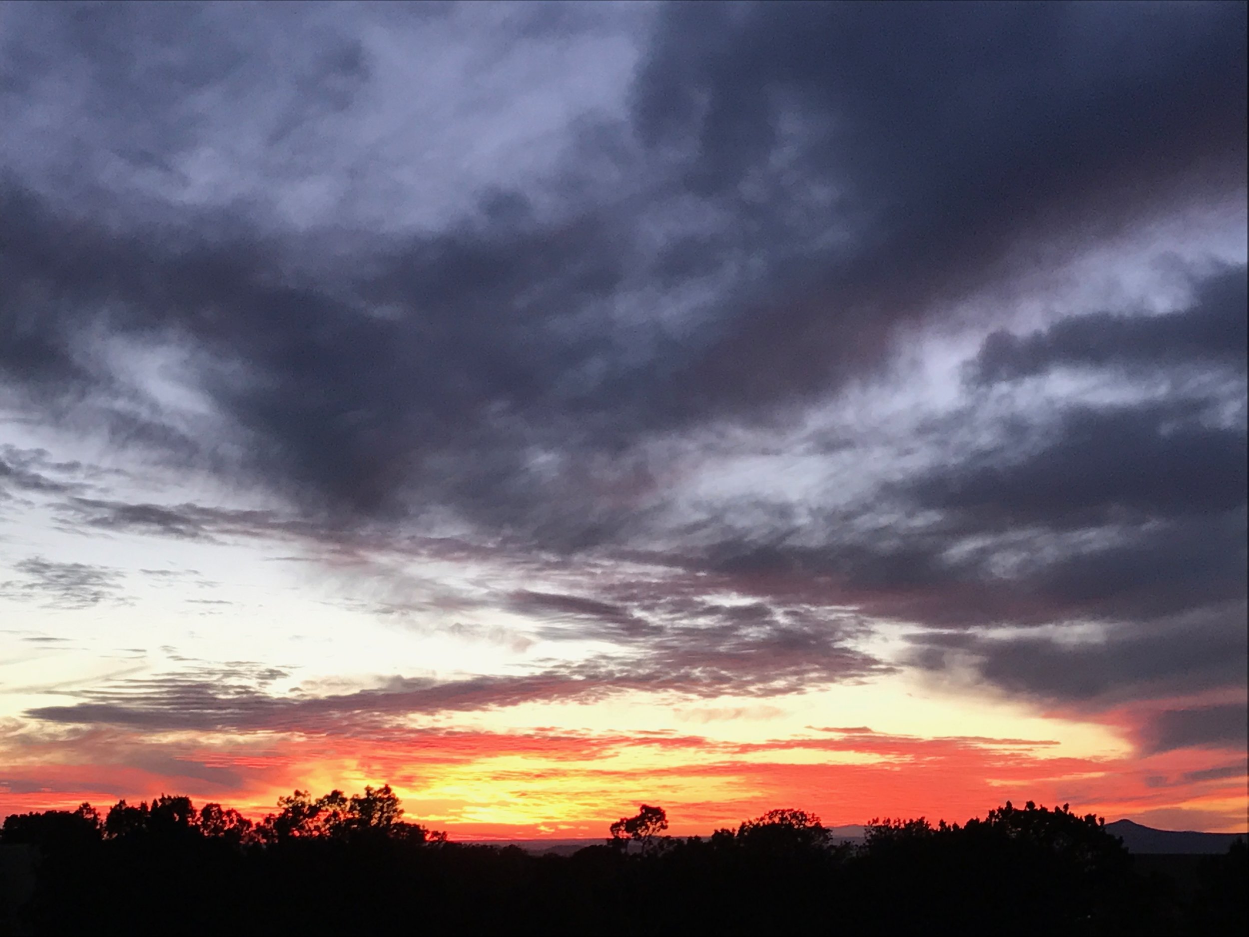 A lipstick sunset outside of Las Vegas, New Mexico. (Image: KanonOnCars.com)